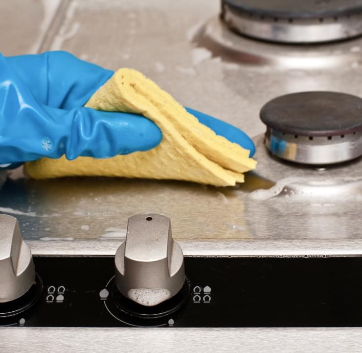 cleaning kitchen stove